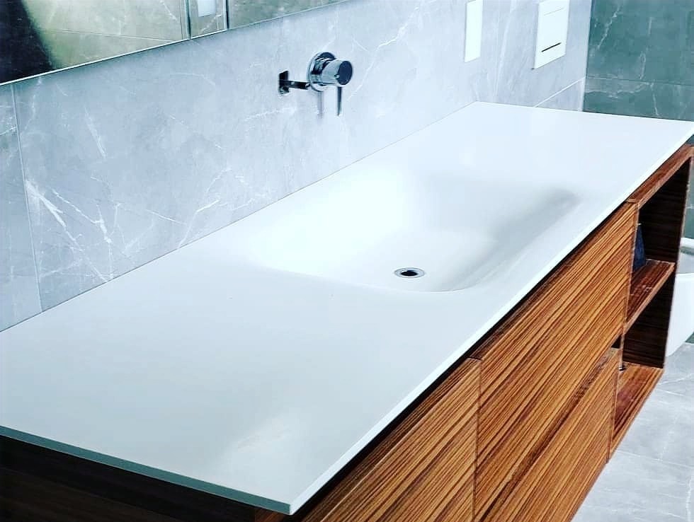 Backlit thermoformed solid surface feature panel