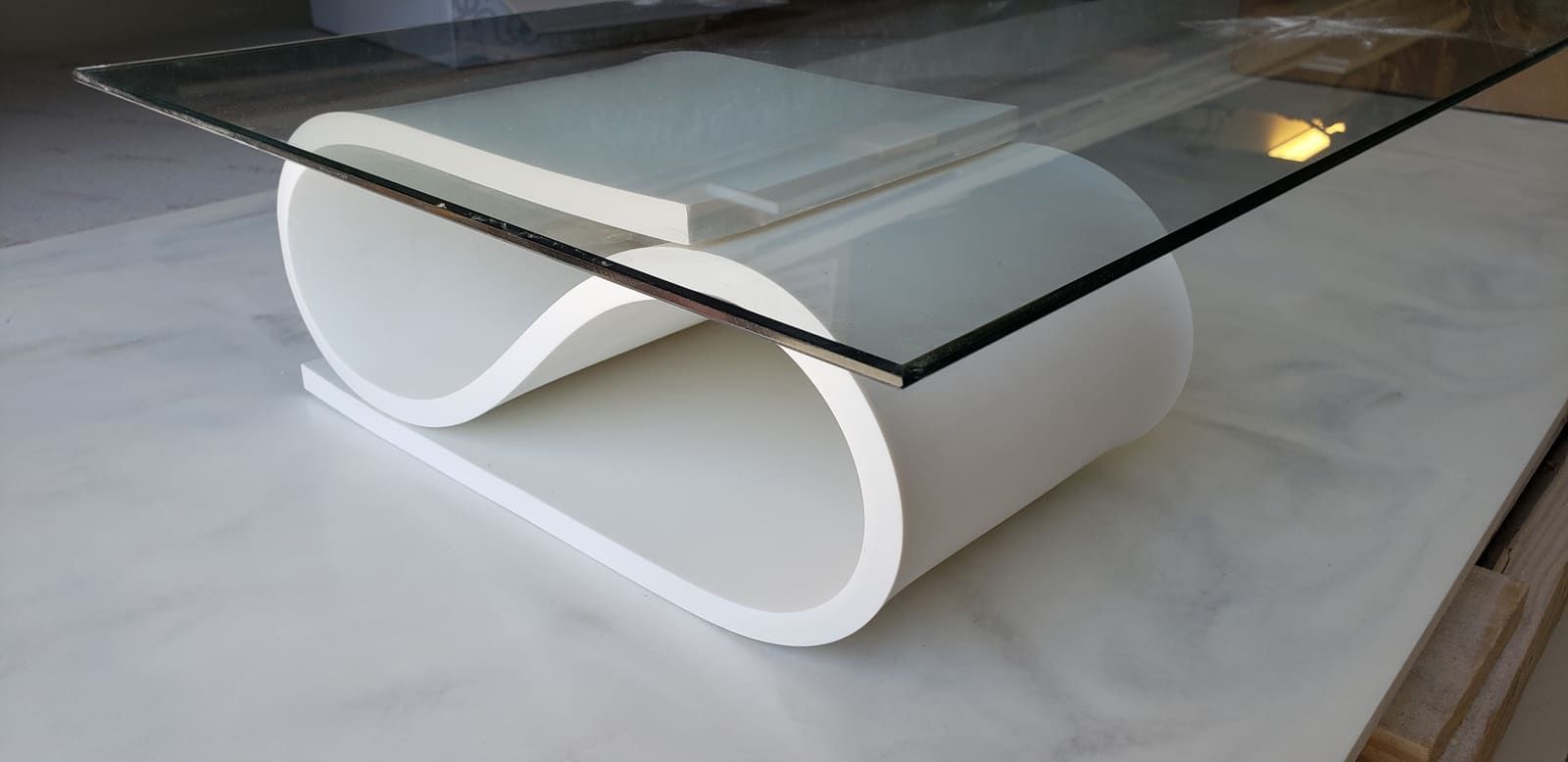 Thermoformed solid surface curved into a three-dimensional shape